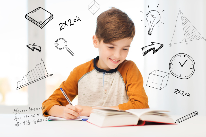 education, childhood, people, homework and school concept - smiling student boy with book writing to notebook at home over mathematical doodles